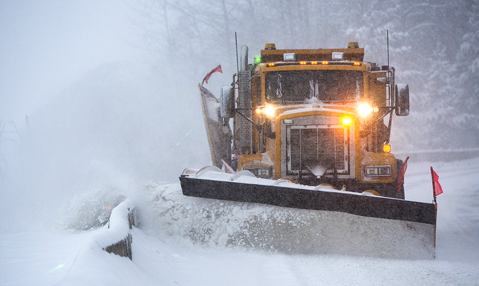 A snow plow plowing snow