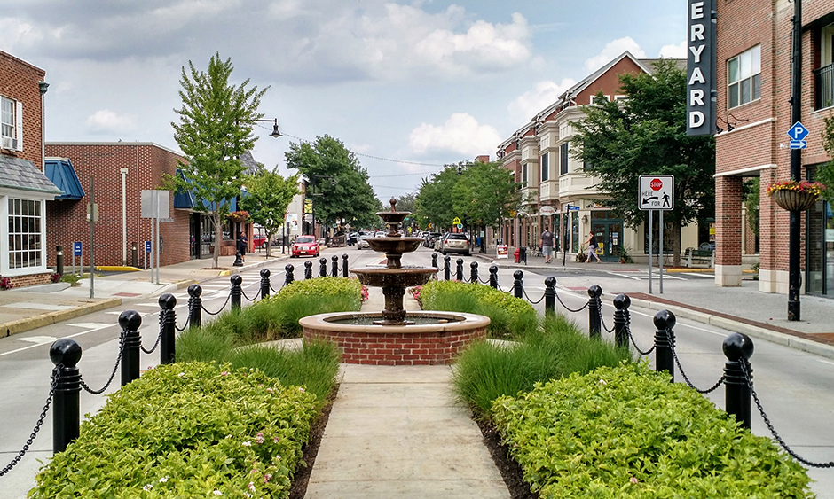 A fountain on an island in the middle of a two-way road