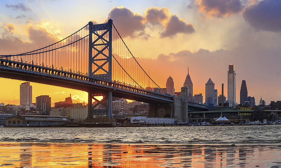 Picture of the Ben Franklin Bridge above the Delaware River at sunset