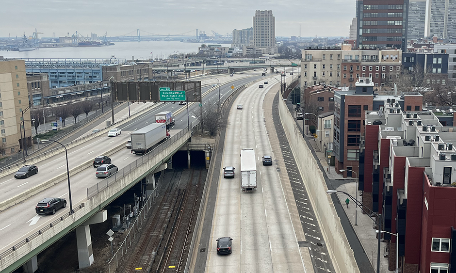Cars including two semis hauling freight drive on I-95 in Philadelphia