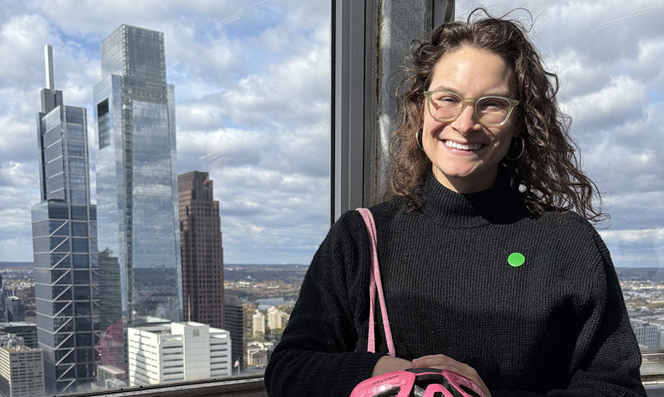 DVRPC staff member Jen Farris with Philadelphia skyscrapers behind her