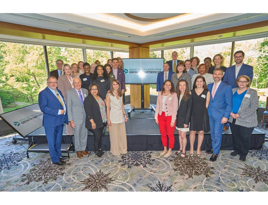 A group of about 20 people from economic development organizations gather on a stage during the Regional Growth Partnership launch event on May 5, 2026.
