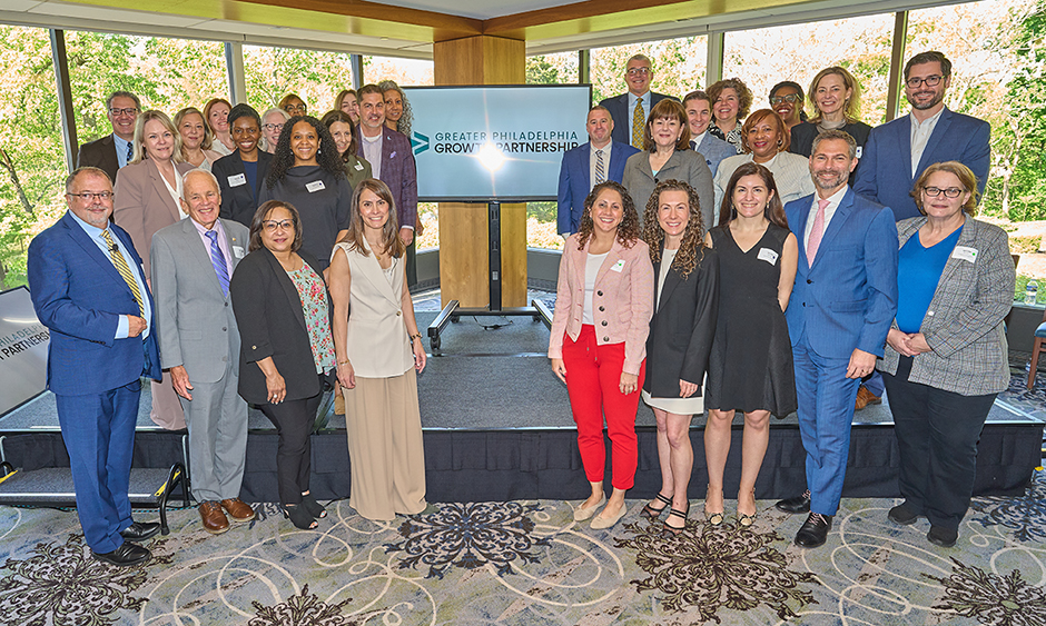 A group of about 20 people from economic development organizations gather on a stage during the Regional Growth Partnership launch event on May 5, 2026